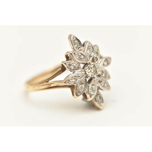 452 - A 9CT GOLD DIAMOND DRESS RING, floral cluster of single cut diamonds, each illusion set, to the trif... 