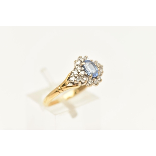 455 - AN 18CT GOLD SAPPHIRE AND DIAMOND RING, a principally set oval cut light blue sapphire, prong set wi... 