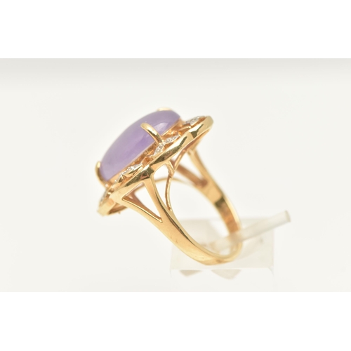 456 - A 14CT GOLD LAVENDAR JADE AND DIAMOND DRESS RING, set with an oval cut lavendar jade cabochon, four ... 