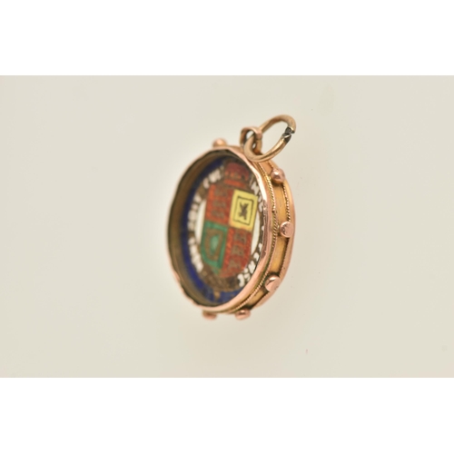 466 - AN EDWARDIAN ENAMEL PENDANT, the central coin with enamel reverse detail, within a 9ct gold surmount... 