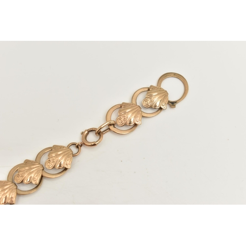 467 - A 9CT YELLOW GOLD BRACELET, designed as a series of scroll design links, with plain polished spacers... 