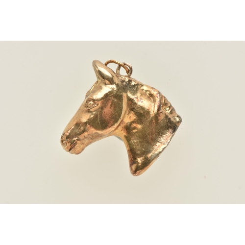 472 - A 9CT YELLOW GOLD HORSE CHARM, the plain polished horse head charm, with jump ring surmount, hallmar... 