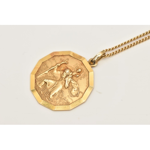 473 - A YELLOW METAL SAINT CHRISTOPHER PENDANT AND CHAIN, the pendant of plain polished design, suspending... 