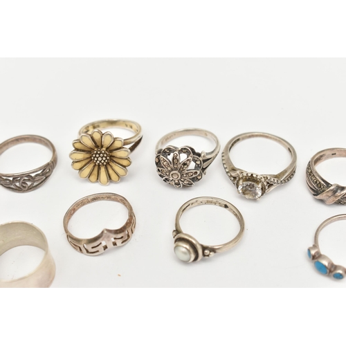 520 - A COLLECTION OF WHITE METAL RINGS, nine rings in total, to include a floral enamel ring, a split pea... 