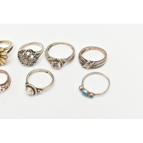 520 - A COLLECTION OF WHITE METAL RINGS, nine rings in total, to include a floral enamel ring, a split pea... 