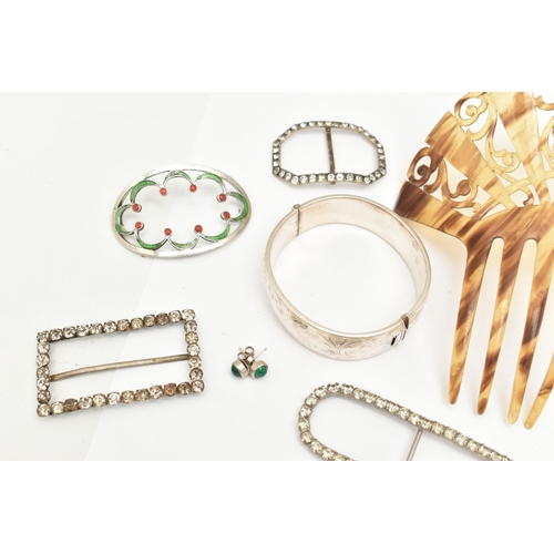 521 - A SILVER HINGED BANGLE, BELT BUCKLES AND A HAIR SLIDE, the silver bangle (clasp requires some attent... 