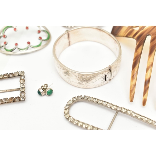 521 - A SILVER HINGED BANGLE, BELT BUCKLES AND A HAIR SLIDE, the silver bangle (clasp requires some attent... 