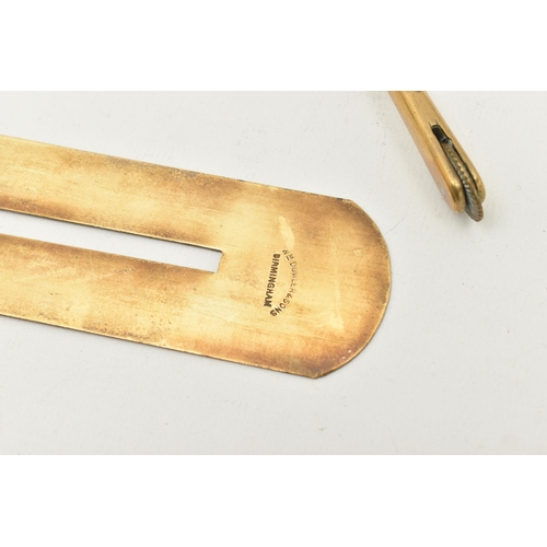 528 - A PAIR OF BRASS STIRRUPS AND A BUTTON POLISHING GUARD