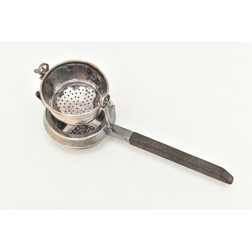 529 - A 'GARRARD & CO' SILVER TEA STRAINER, fitted with a wooden handle, hallmarked 'Garrard & Co Ltd' Lon... 