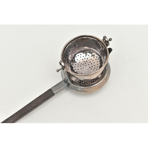 529 - A 'GARRARD & CO' SILVER TEA STRAINER, fitted with a wooden handle, hallmarked 'Garrard & Co Ltd' Lon... 