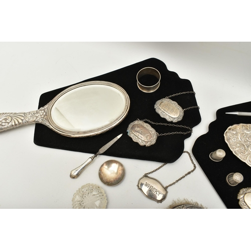 541 - ASSORTED SILVER ITEMS, to include a vanity hair brush and hand held mirror, embossed with a foliate ... 