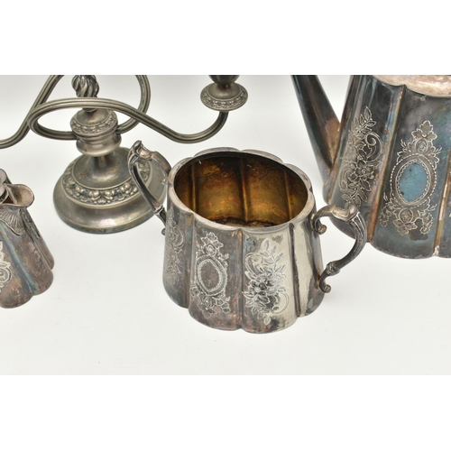 555 - AN ASSORTMENT OF WHITE METAL, to include a three piece tea set with floral detail, together with a t... 