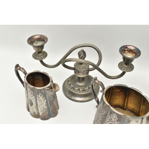 555 - AN ASSORTMENT OF WHITE METAL, to include a three piece tea set with floral detail, together with a t... 