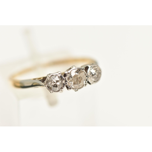 569 - A YELLOW METAL THREE STONE DIAMOND RING, set with three old cut diamonds, estimated total diamond we... 