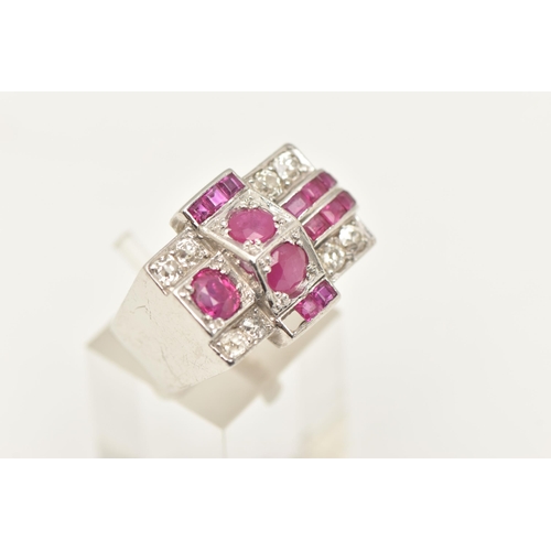 570 - A MID CENTURY RUBY AND DIAMOND RING, a white metal retro design ring set with one oval cut, two circ... 