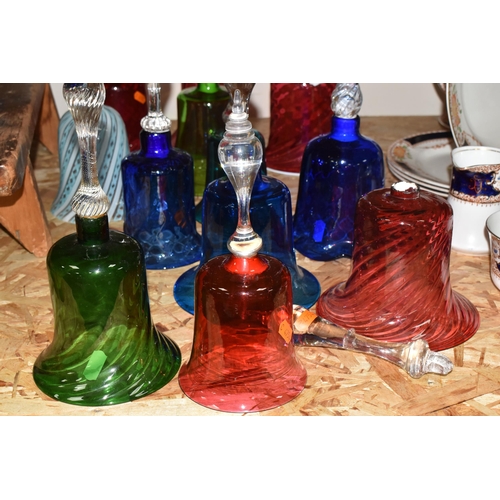 758 - A COLLECTION OF TWELVE COLOURED GLASS BELLS of assorted size and patterns with various handles and p... 