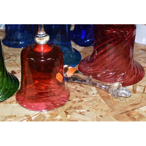 758 - A COLLECTION OF TWELVE COLOURED GLASS BELLS of assorted size and patterns with various handles and p... 