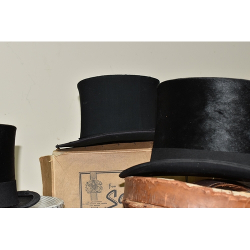 765 - A GROUP OF EARLY 20TH CENTURY TOP HATS, comprising  a Lincoln-Bennett & Co Burlington Gardens, Old B... 