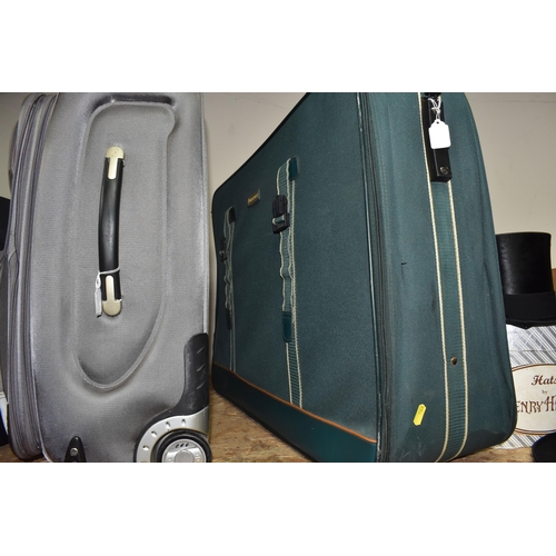 766 - THREE NYLON SUITCASES, comprising a green 'Vanguard' suitcase, approx. size 56cm x 80cm, a silver co... 