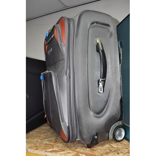 766 - THREE NYLON SUITCASES, comprising a green 'Vanguard' suitcase, approx. size 56cm x 80cm, a silver co... 