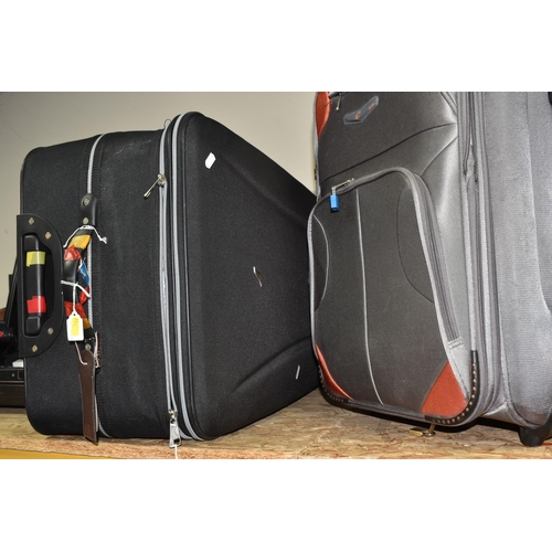 766 - THREE NYLON SUITCASES, comprising a green 'Vanguard' suitcase, approx. size 56cm x 80cm, a silver co... 