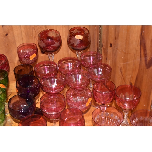 781 - A GROUP OF VARIOUS VINTAGE COLOURED DRINKING GLASSES, comprising two cut to clear tall wine glasses ... 