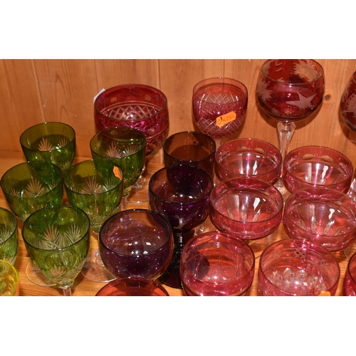 781 - A GROUP OF VARIOUS VINTAGE COLOURED DRINKING GLASSES, comprising two cut to clear tall wine glasses ... 