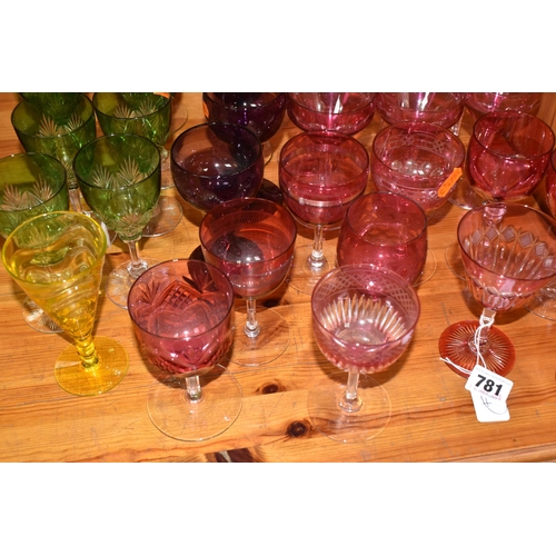 781 - A GROUP OF VARIOUS VINTAGE COLOURED DRINKING GLASSES, comprising two cut to clear tall wine glasses ... 