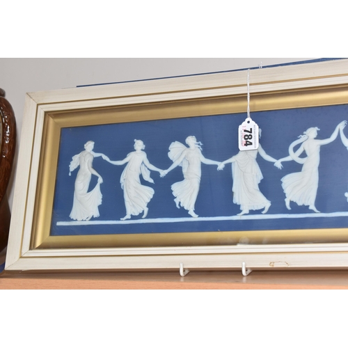 784 - A FRAMED WEDGWOOD 'DANCING HOURS' PLAQUE, the blue dipped plaque featuring six dancing classical mai... 