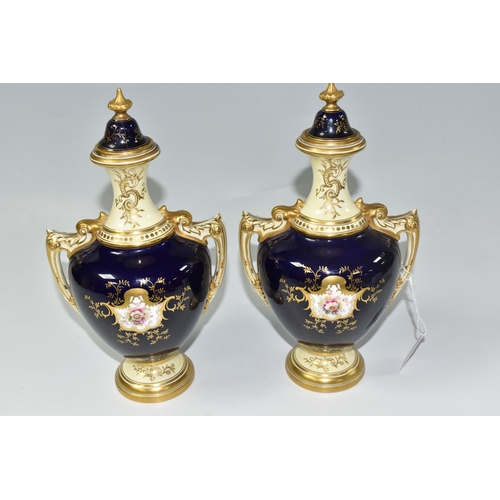 807 - A PAIR OF COALPORT COVERED VASES, the twin handled vases painted with panels of birds and flowers, a... 