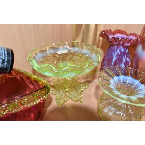 810 - A COLLECTION OF URANIUM GLASS WARES, to include a cranberry and white textured vase with partially c... 