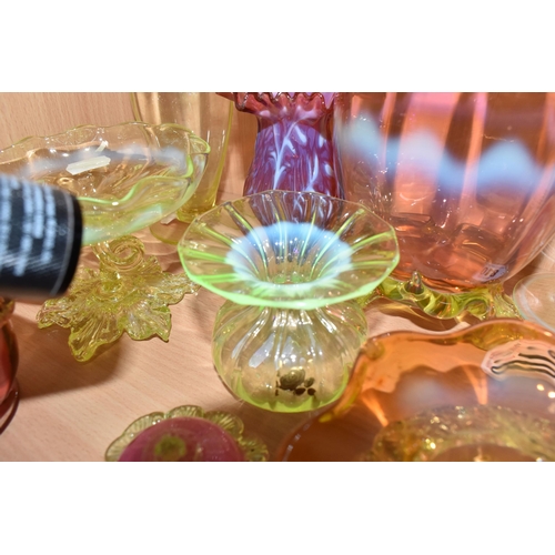 810 - A COLLECTION OF URANIUM GLASS WARES, to include a cranberry and white textured vase with partially c... 