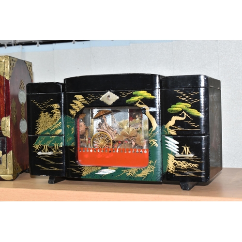 818 - THREE ORIENTAL JEWELLERY BOXES, comprising a Japanese painted black lacquer musical rickshaw example... 