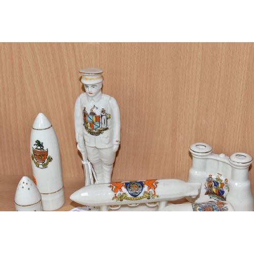 820 - A COLLECTION OF MILITARY THEMED CRESTED WARE, ten pieces in the forms of a cannon, a Red Cross van (... 