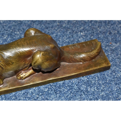 828 - AFTER LOUIS RICHÉ A BRONZED FIGURE OF A RECUMBENT GERMAN SHEPHERD DOG, on a rectangular base, signed... 