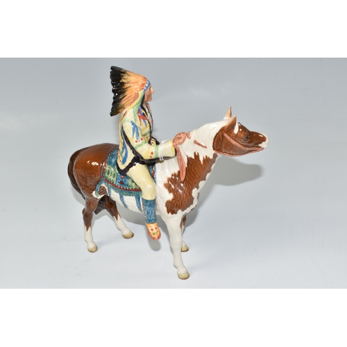 832 - A BESWICK MOUNTED INDIAN ON SKEWBALD HORSE model 1391, introduced 1955 and retired in 1990, designed... 