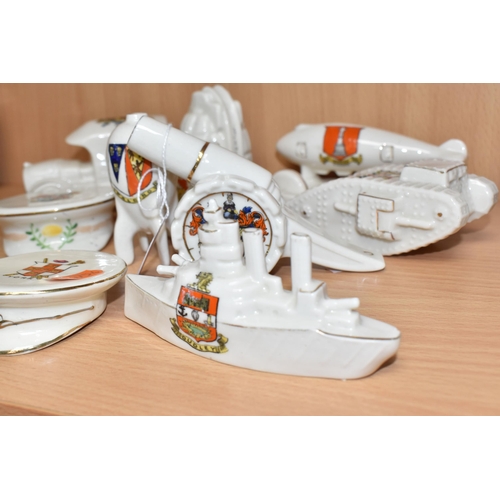 836 - A GROUP OF MILITARY THEMED CRESTED WARE comprising a battleship, zeppelin, a tank, a grenade, a cann... 