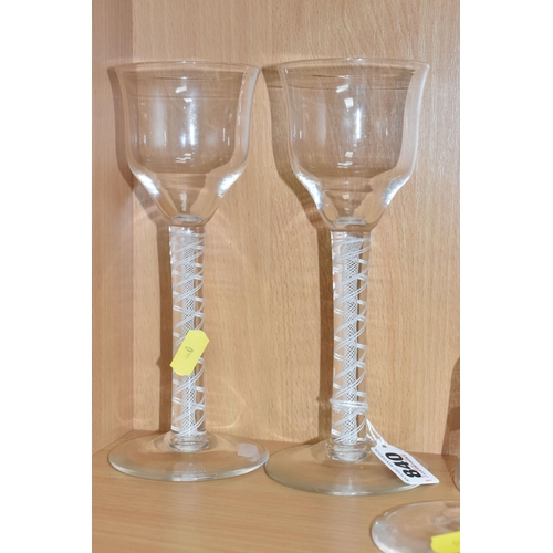 840 - A PAIR OF 'OPAQUE AIR TWIST' WINE GLASSES AND A BROKEN GLASS, with ogee bowls and a spiral twist wit... 