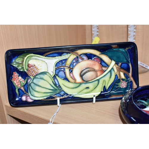 841 - A MOORCROFT 'QUEEN'S CHOICE' RECTANGULAR DISH AND AN INVERTED RIM 'ANEMONE' BOWL comprising a shaped... 