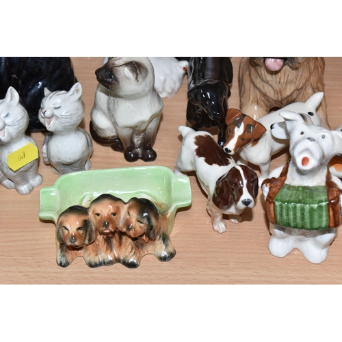 847 - A COLLECTION OF BESWICK CATS AND DOGS to include sixteen dog sculptures to include a Border Collie '... 