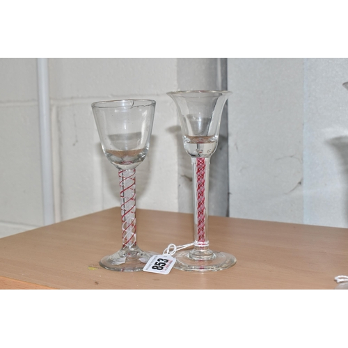 853 - TWO AIR TWIST STEMMED ENGLISH GEORGIAN GLASSES to include one glass with a cranberry double helix an... 