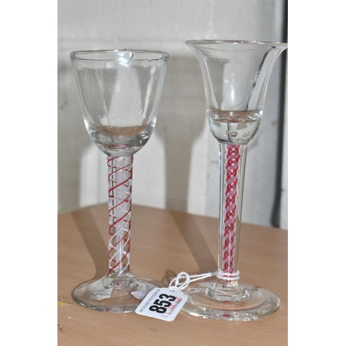 853 - TWO AIR TWIST STEMMED ENGLISH GEORGIAN GLASSES to include one glass with a cranberry double helix an... 