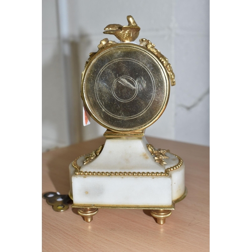 860 - A VINTAGE FRENCH GILDED AND ONYX CLOCK with a painted enamel clock face with Arabic numerals and flo... 