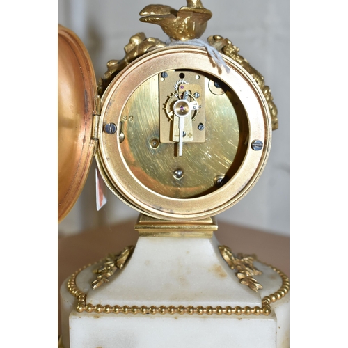 860 - A VINTAGE FRENCH GILDED AND ONYX CLOCK with a painted enamel clock face with Arabic numerals and flo... 