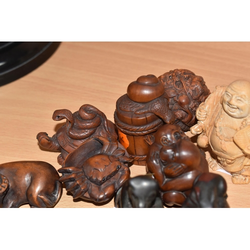 864 - A GROUP OF TEN NETSUKE FIGURES comprising an ox, a frog and a barrel, a tortoise with a snake, a cra... 