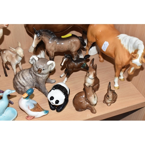 866 - A GROUP OF TWENTY-TWO BESWICK ANIMAL comprising 'Palomino Mare Facing Right' No. 1991, a 'brown Shir... 