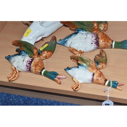 870 - A GROUP OF FOUR BESWICK BIRD WALL PLAQUES comprising a trio of three mallards to include 562-2, 562-... 