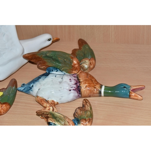 870 - A GROUP OF FOUR BESWICK BIRD WALL PLAQUES comprising a trio of three mallards to include 562-2, 562-... 