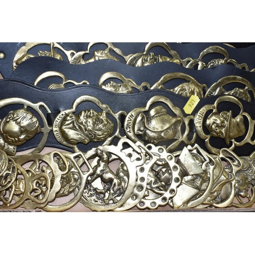 921 - ONE BOX OF VINTAGE BRASS HORSE MEDALLIONS ON LEATHER STRAPS, to include ten leather straps all with ... 