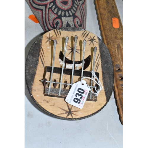 930 - A QUANTITY OF WOODEN INTERNATIONAL ITEMS to include a carved Kalimba with five keys, an ornamental K... 